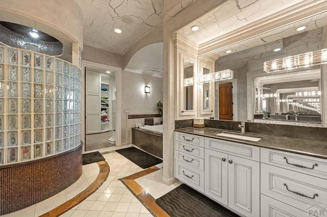 full bath featuring recessed lighting, vanity, and tile patterned floors