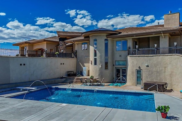 outdoor pool with a patio area