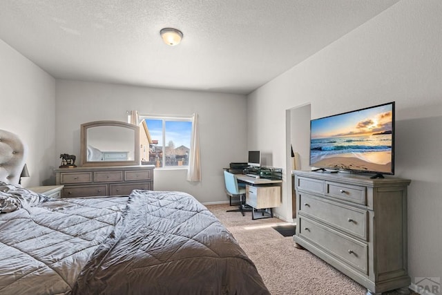 bedroom featuring baseboards and light colored carpet