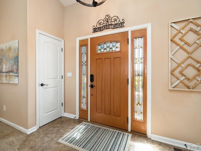406 N Idledale Dr, Pueblo West, CO 81007 - tiled foyer featuring baseboards