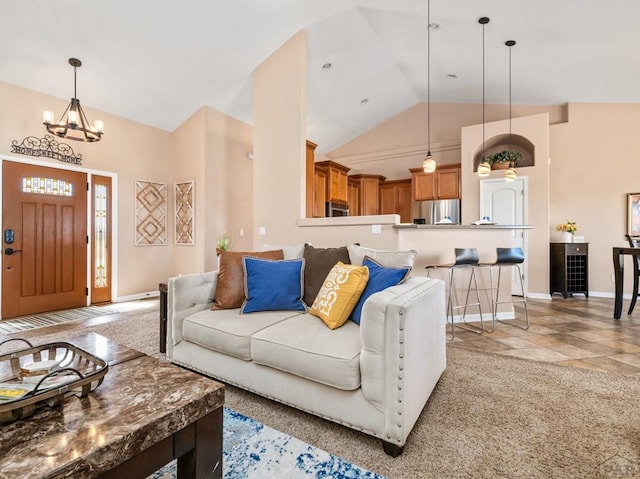 406 N Idledale Dr, Pueblo West, CO 81007 - living area with a chandelier and high vaulted ceiling