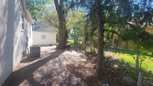 view of yard with central air condition unit