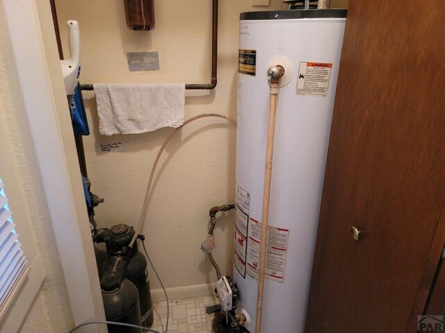 utility room with water heater