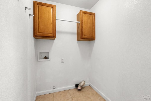503 N Iliff Dr, Pueblo West, CO 81007 - laundry area featuring cabinet space, hookup for a washing machine, baseboards, light tile patterned floors, and hookup for a gas dryer