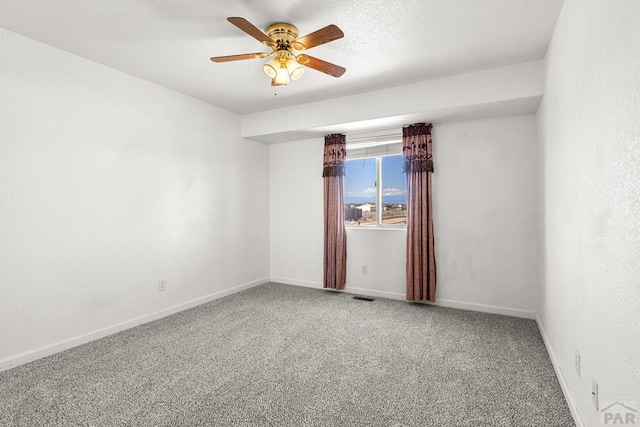 503 N Iliff Dr, Pueblo West, CO 81007 - empty room featuring carpet, a ceiling fan, and baseboards