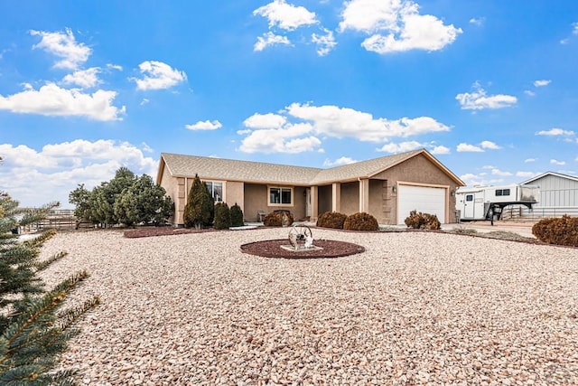 503 N Iliff Dr, Pueblo West, CO 81007 - single story home featuring stucco siding, a garage, driveway, and fence