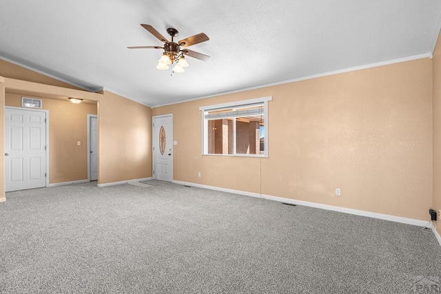 503 N Iliff Dr, Pueblo West, CO 81007 - unfurnished room featuring ceiling fan, ornamental molding, baseboards, carpet flooring, and vaulted ceiling