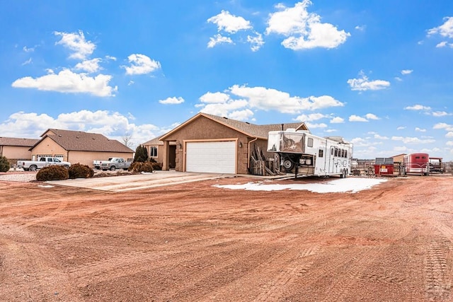 503 N Iliff Dr, Pueblo West, CO 81007 - view of front of home featuring a garage and concrete driveway