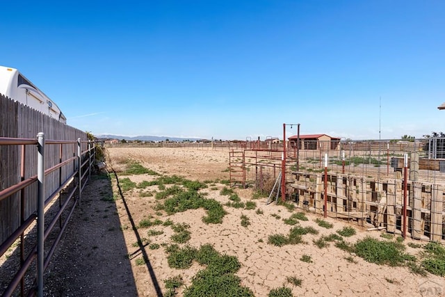 503 N Iliff Dr, Pueblo West, CO 81007 - view of yard with fence, a rural view, and an outdoor structure