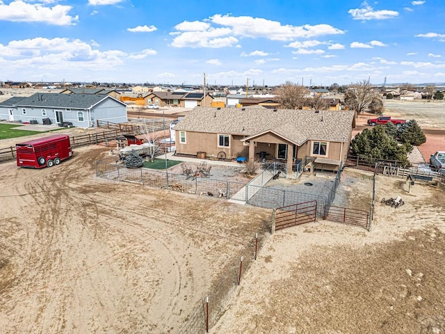 503 N Iliff Dr, Pueblo West, CO 81007 - back of house featuring a gate, a fenced backyard, stucco siding, a residential view, and a patio area