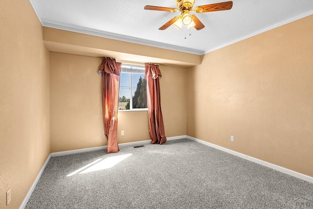 503 N Iliff Dr, Pueblo West, CO 81007 - spare room featuring ceiling fan, carpet floors, baseboards, and ornamental molding