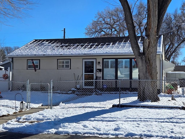 view of front of property with fence and stucco siding