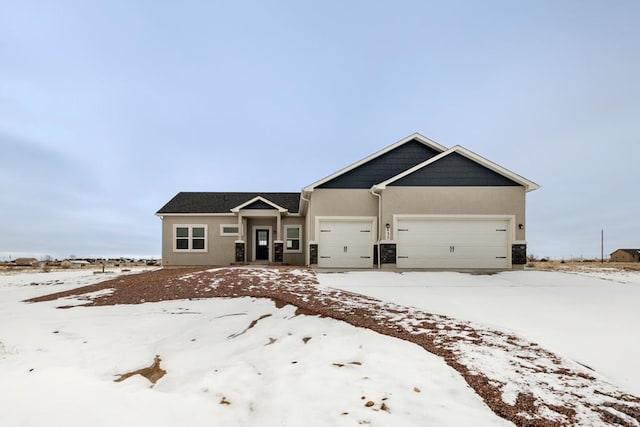 view of front facade featuring an attached garage and stucco siding