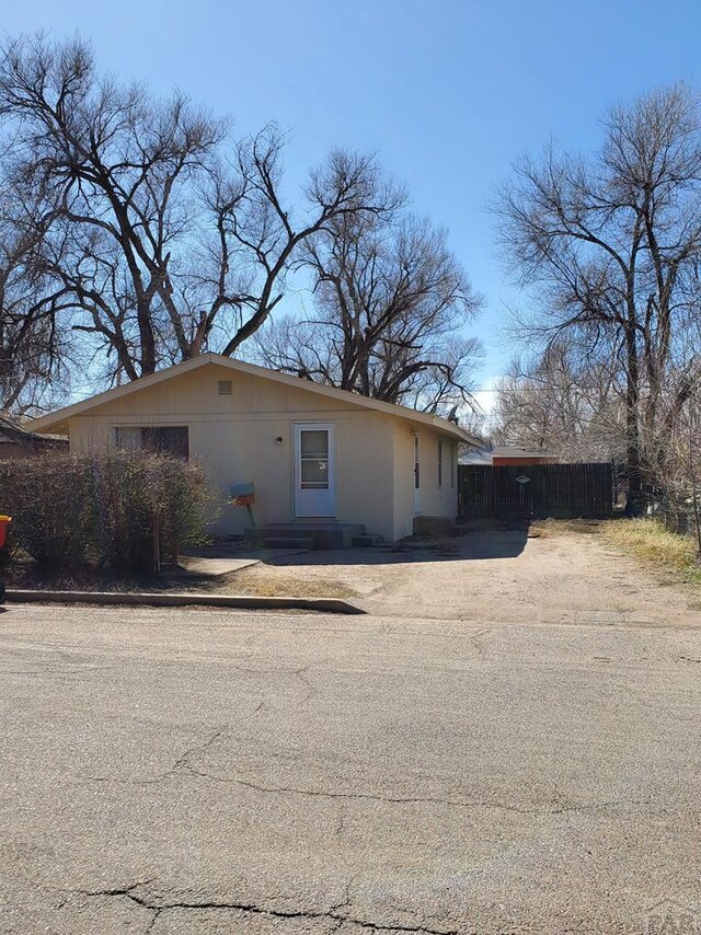 view of front of property featuring fence