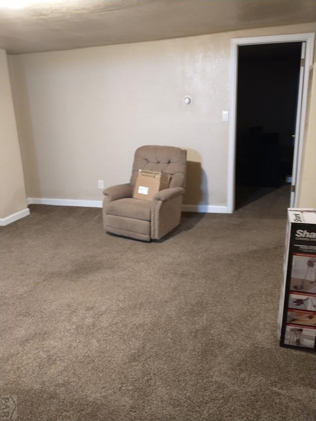 unfurnished room featuring carpet flooring and baseboards