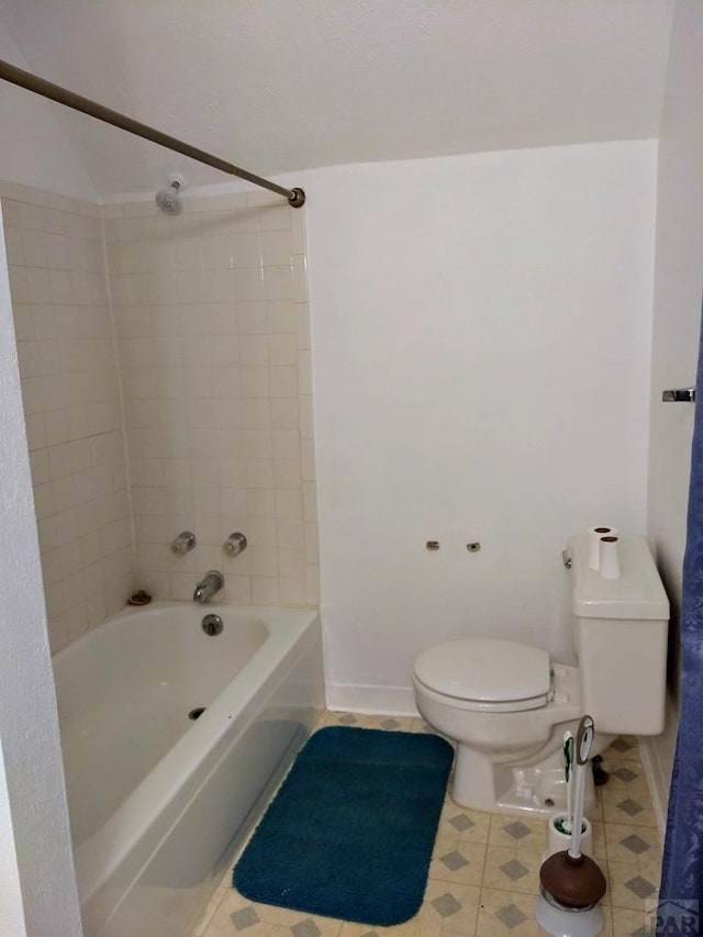 full bathroom featuring shower / tub combination, toilet, and baseboards