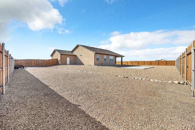 exterior space with a fenced backyard