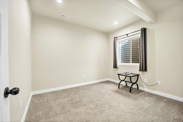 spare room featuring recessed lighting, baseboards, beam ceiling, and carpet flooring