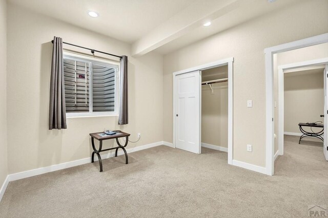 bedroom featuring recessed lighting, light colored carpet, and baseboards