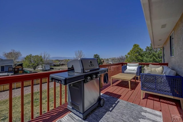 769 S Mccoy Dr, Pueblo West, CO 81007 - wooden terrace with outdoor lounge area and a grill