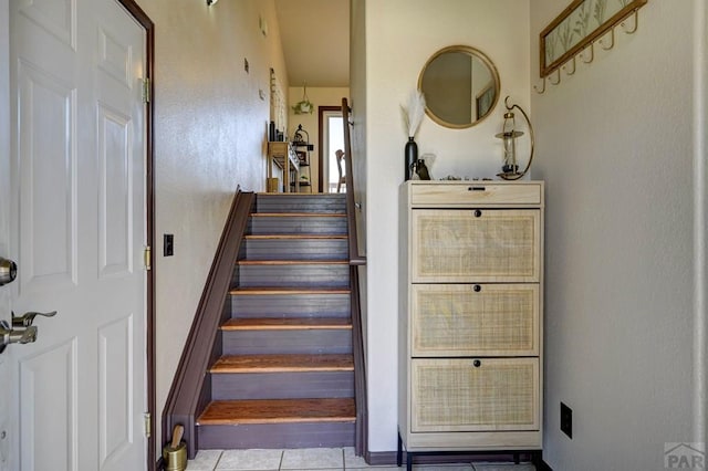 769 S Mccoy Dr, Pueblo West, CO 81007 - stairs featuring tile patterned flooring and baseboards