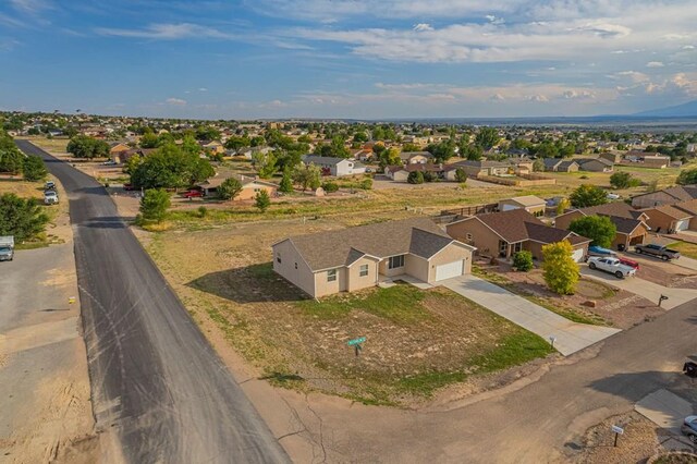 birds eye view of property with a residential view