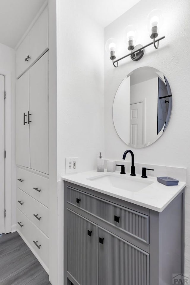 bathroom featuring wood finished floors and vanity