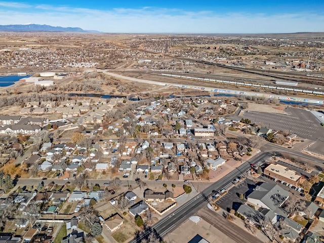 birds eye view of property with a residential view and a mountain view