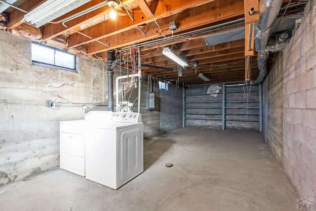 below grade area featuring independent washer and dryer and electric panel