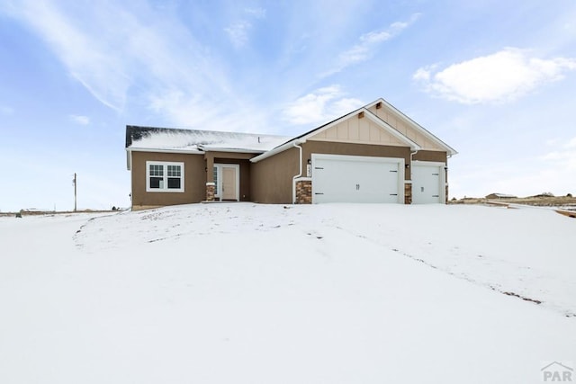 view of front of home with an attached garage and board and batten siding