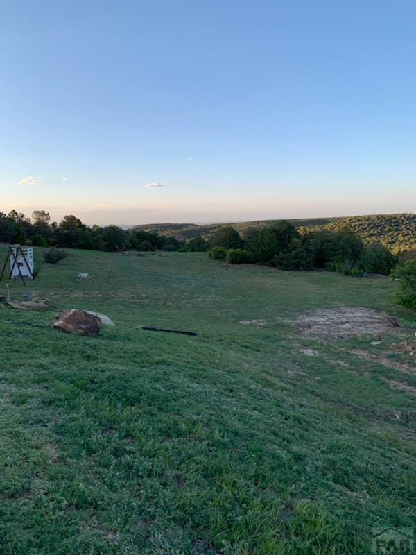 1771 Sunrise Rd, Walsenburg, CO 81089 - yard at dusk with a rural view