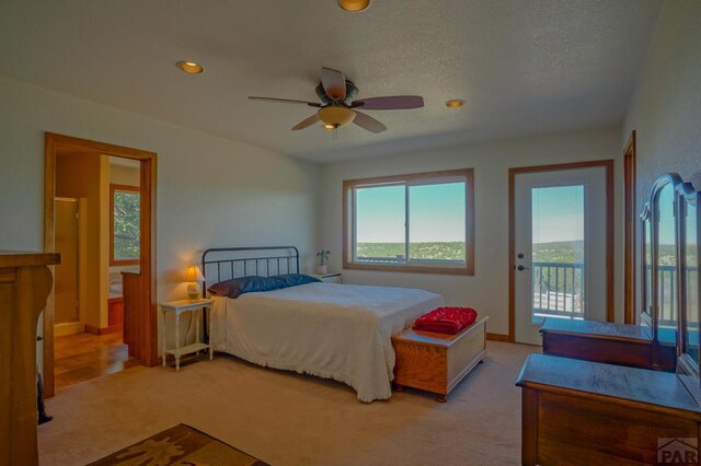 1771 Sunrise Rd, Walsenburg, CO 81089 - carpeted bedroom featuring baseboards, recessed lighting, ceiling fan, access to exterior, and a textured ceiling