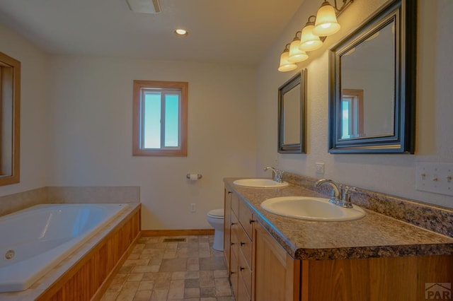1771 Sunrise Rd, Walsenburg, CO 81089 - full bathroom with a sink, baseboards, a bath, and double vanity