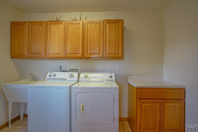 1771 Sunrise Rd, Walsenburg, CO 81089 - washroom featuring light tile patterned floors, washing machine and dryer, cabinet space, and baseboards