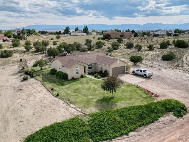 birds eye view of property featuring a mountain view