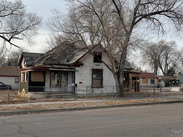 bungalow-style house with a fenced front yard