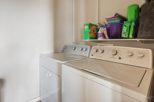 laundry area with washing machine and dryer and laundry area