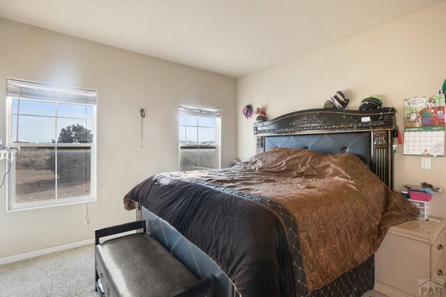 carpeted bedroom with baseboards