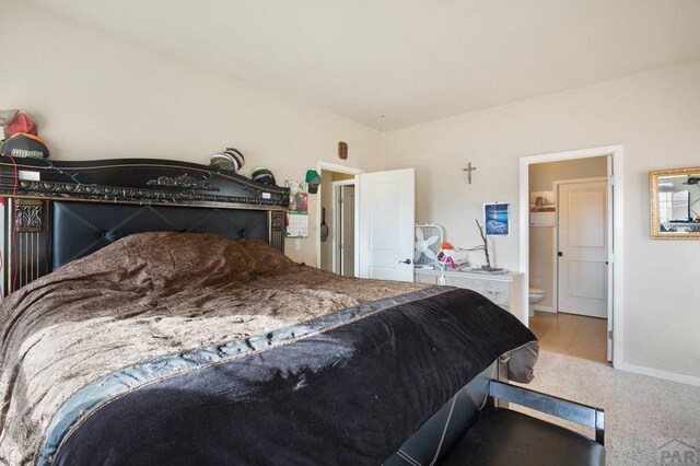 carpeted bedroom with baseboards