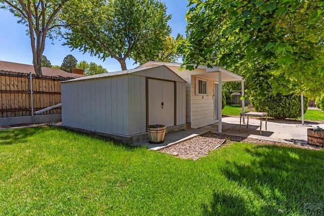 view of shed featuring fence