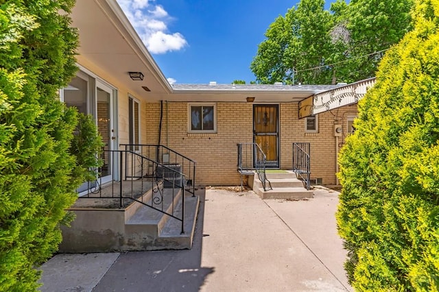 exterior space with brick siding