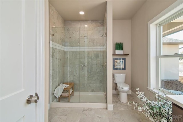 bathroom with a stall shower, baseboards, toilet, marble finish floor, and recessed lighting