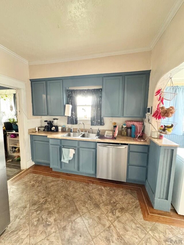 318 W 10th St, La Junta, CO 81050 - kitchen with dishwasher, a sink, blue cabinets, crown molding, and healthy amount of natural light