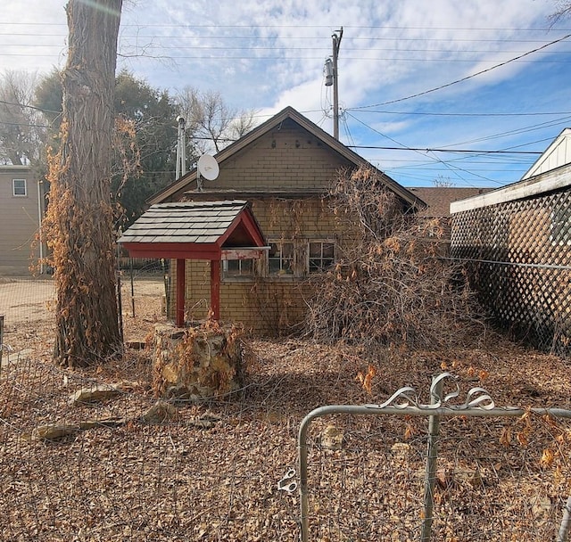 view of property exterior with fence