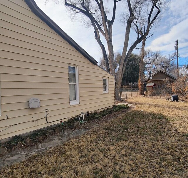 view of home's exterior featuring fence