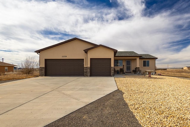 single story home with stone siding, concrete driveway, an attached garage, and stucco siding