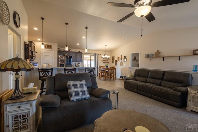 living area featuring lofted ceiling, a ceiling fan, and recessed lighting