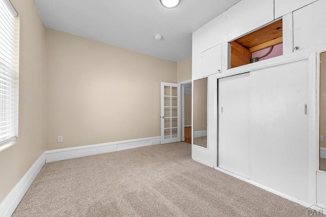 320 E Godding, Trinidad, CO 81082 - unfurnished bedroom featuring carpet, french doors, and a closet