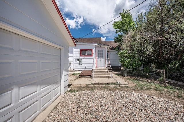 320 E Godding, Trinidad, CO 81082 - view of front of house featuring entry steps, a garage, and a shingled roof