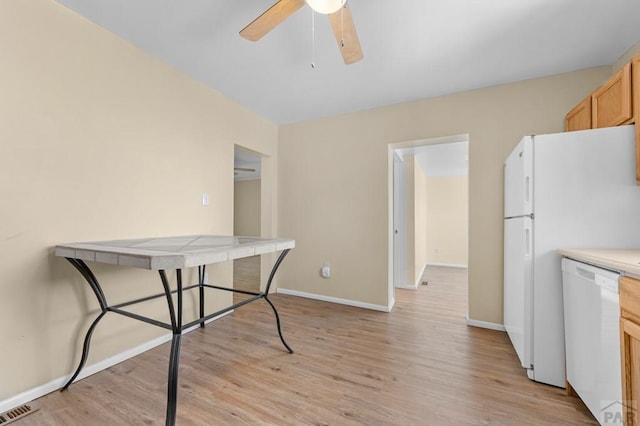320 E Godding, Trinidad, CO 81082 - kitchen with white appliances, light wood-style flooring, a ceiling fan, and light countertops